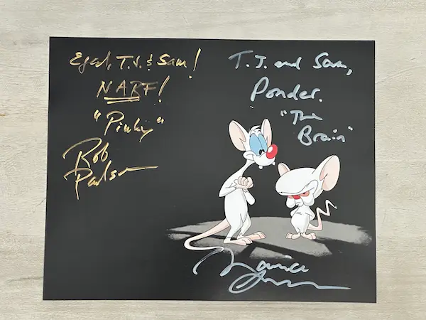 Picture of Pinky and the Brain on a black background signed by Rob Paulsen and Maurice LaMarche